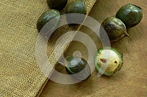 Djenkol bean or luk nieng fruit tropical plant on wooden board