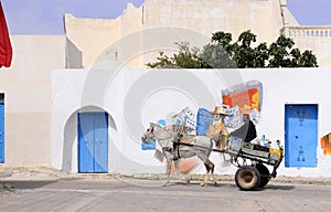 Tunisia - Djerba Island, Man on Old Wagon with Colorful Graffiti Art