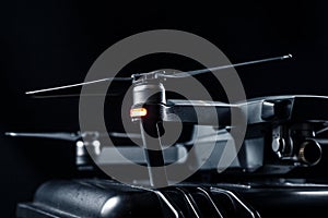 DJI Mavic 2 - Flying in the dark, on black background. Closeup on black background. photo