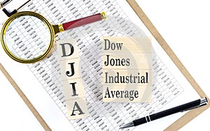 DJIA text on wooden block on chart background