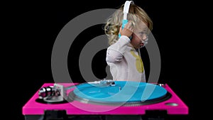 Djing small girl with headphones