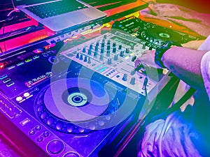 DJs are turntablism turntables plate mixer night party pub Motion blur wite light sunset