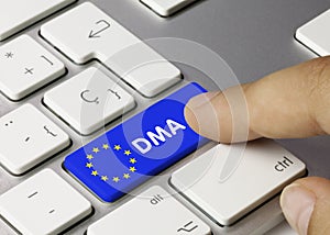 DMA Digital Markets Act - Inscription on Blue Keyboard Key photo