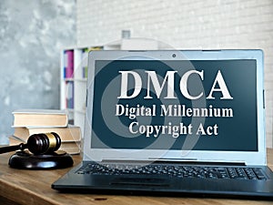 DMCA Digital Millennium Copyright Act on laptop and gavel.