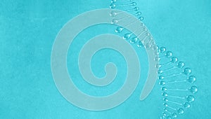 Dna spiral from water on a turquoise background