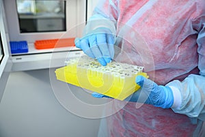Dna test in the lab. Test tubes with biomaterials in the hands of a laboratory assistant