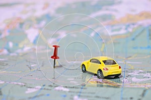 Dnepr, Ukraine - January  17, 2018:  toy car rides on a geographical map of the world. Gps navigation. Points of coordinates. The