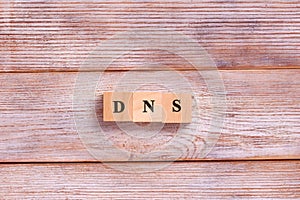 DNS word letters on wooden blocks. Domain Name System. Network, web, communication, technology concept