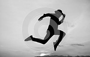Do or Die. personal achievement goal. man silhouette jump on sky background. confident businessman running. daily