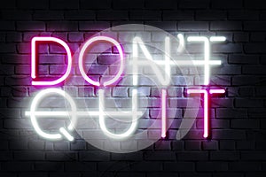 Do It Don\'t Quit Neon Sign on a dark wall photo
