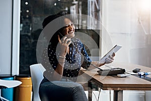 Always do follow ups on your dealings. a young female designer making a phone call while holding a digital tablet at her