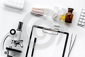 Do medcal tests. Microscope, tablet, pills and test tube on white background top view