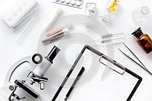 Do medcal tests. Microscope, tablet, pills and test tube on white background top view