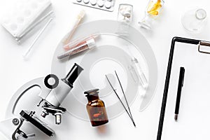 Do medcal tests. Microscope, tablet, pills and test tube on white background top view