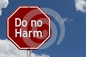 Do no harm message on red street stop sign photo