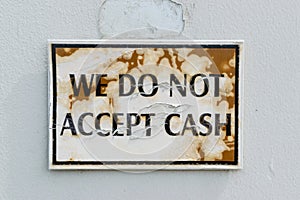 Do not accept cash sign on old building