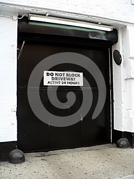 Do Not Block Driveway Active 24 Hours -- Generic door and active driveway