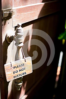 Do not disturb sign antique tablet hang on the wood door