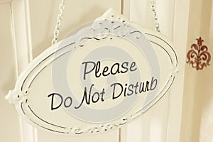 Do Not Disturb Sign Hanging On Door