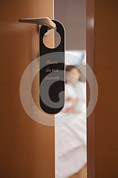 Do not disturb sign on the hotel door, close-up photo