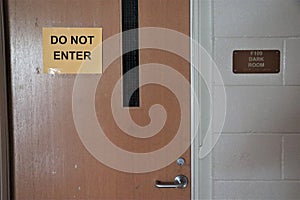 `Do Not Enter` sign on darkroom door
