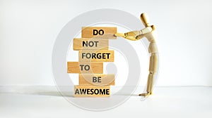 Do not forget to be awesome symbol. Concept words Do not forget to be awesome on wooden blocks on a beautiful white background,