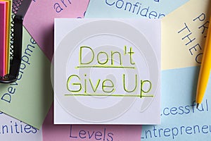 Do Not Give Up written on a note