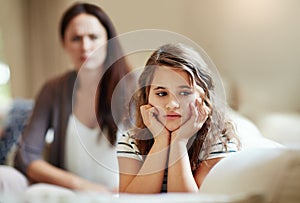 Do not ignore me when I am talking. Cropped shot of a young girl being reprimanded by her mother at home.