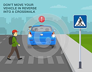 Do not move your vehicle in reverse into a crosswalk. Young male pedestrian crossing the street on zebra crossing.
