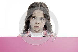 Do not offend children. Girl kid behind pink blank surface copy space. Advertisement concept. Child cute girl looking