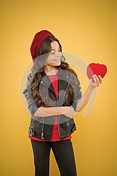 Do not play with my heart. Kid stylish modern girl happy face show heart yellow background. Celebrate valentines day