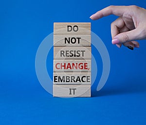 Do not resist change embrace it symbol. Concept words Do not resist change embrace it on wooden blocks. Businessman hand.