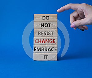 Do not resist change embrace it symbol. Concept words Do not resist change embrace it on wooden blocks. Businessman hand. photo