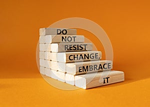 Do not resist change embrace it symbol. Concept words Do not resist change embrace it on wooden blocks. Beautiful orange photo