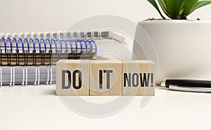 do it now motivation in wooden blocks