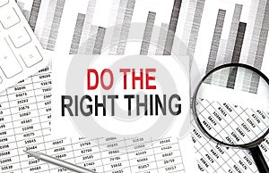 Do The Right Thing text on paper with calculator,magnifier ,pen on graph background