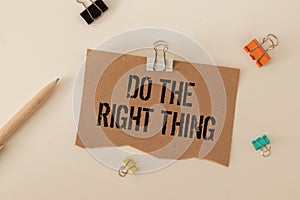 do the right thing. text on torn paper on white backing.
