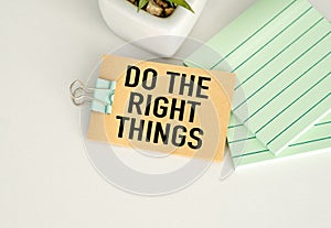 Do the Right Thing. text on torn paper on white backing.