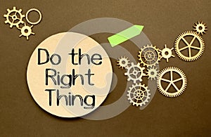 do the right thing. text on torn paper on white backing