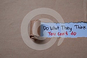 Do What They Think You Can`t Do Text written in torn paper