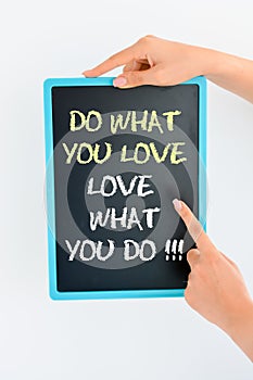 Do what you love and love what you do text on blackboard