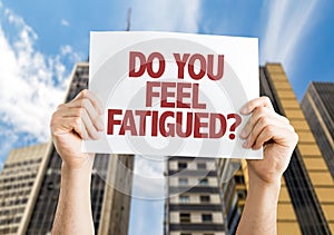 Do You Feel Fatigued? card with cityscape background