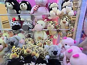 Bunch of doll at claw machine.