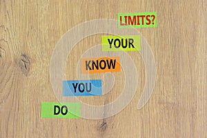 Do you know your limits symbol. Concept words Do you know your limits on colored paper. Beautiful wooden table wooden background.