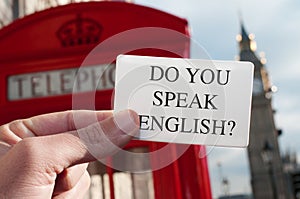 do you speak english? in a signboard with the Big Ben in the background photo