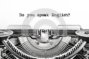 Do you speak English? typed text on a Vintage Typewriter, old paper, closeup.