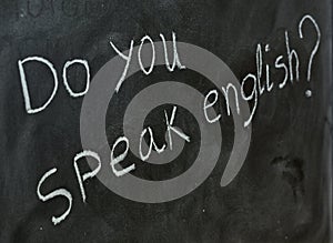 Do you speak English, written on a blackboard photo