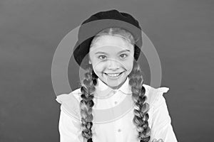 Do you speak french. Fancy style. Little girl with braids ready for school. School fashion concept. Schoolgirl wear