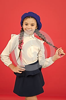 Do you speak french. School fashion concept. Schoolgirl wear formal school uniform and beret hat. Child beautiful girl