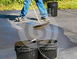 Maintaining an asphalt driveway with blacktop sealer photo